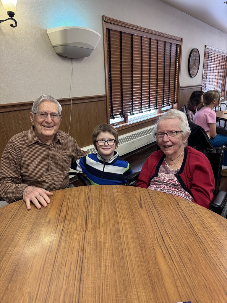 4th graders playing Holiday Bingo and visiting with residents at the Mary Jane Brown Home.