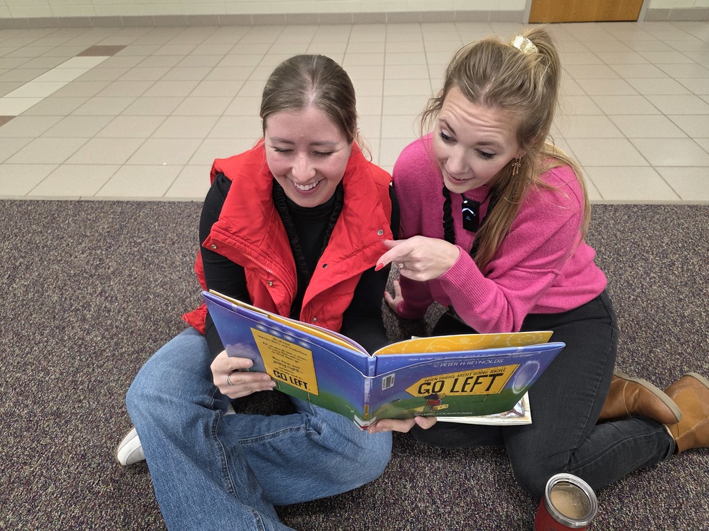 Mrs. Christensen reading to Mrs. Dinger.
