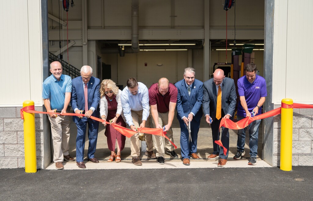 JOC cutting ribbon