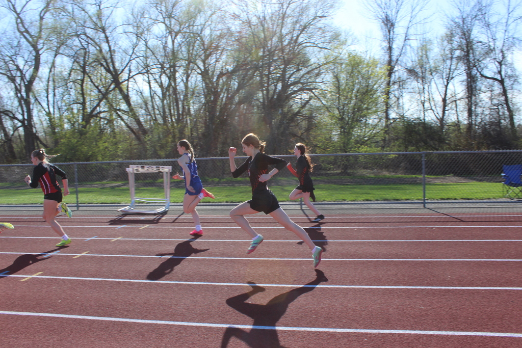 girls running on a track