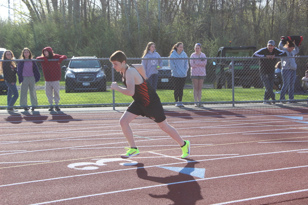 boy running on track
