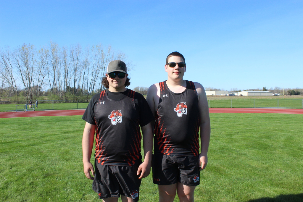 two student athletes standing together