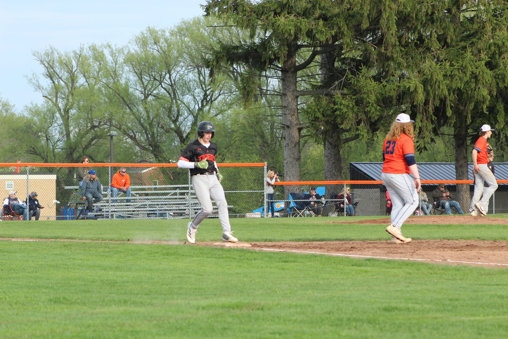 baseball player running to first base