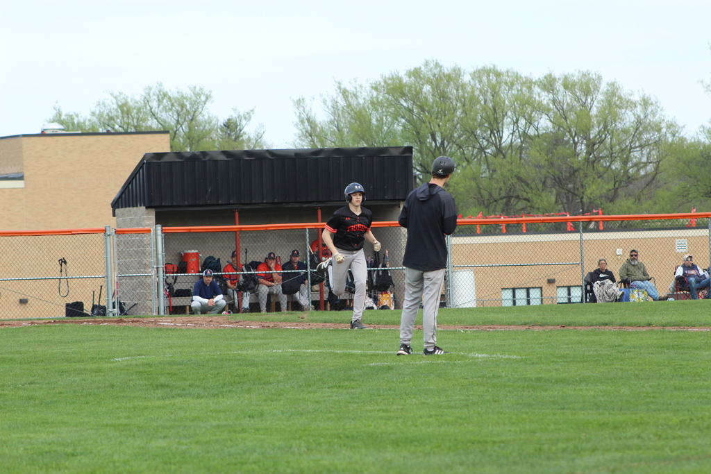 baseball player running to first base