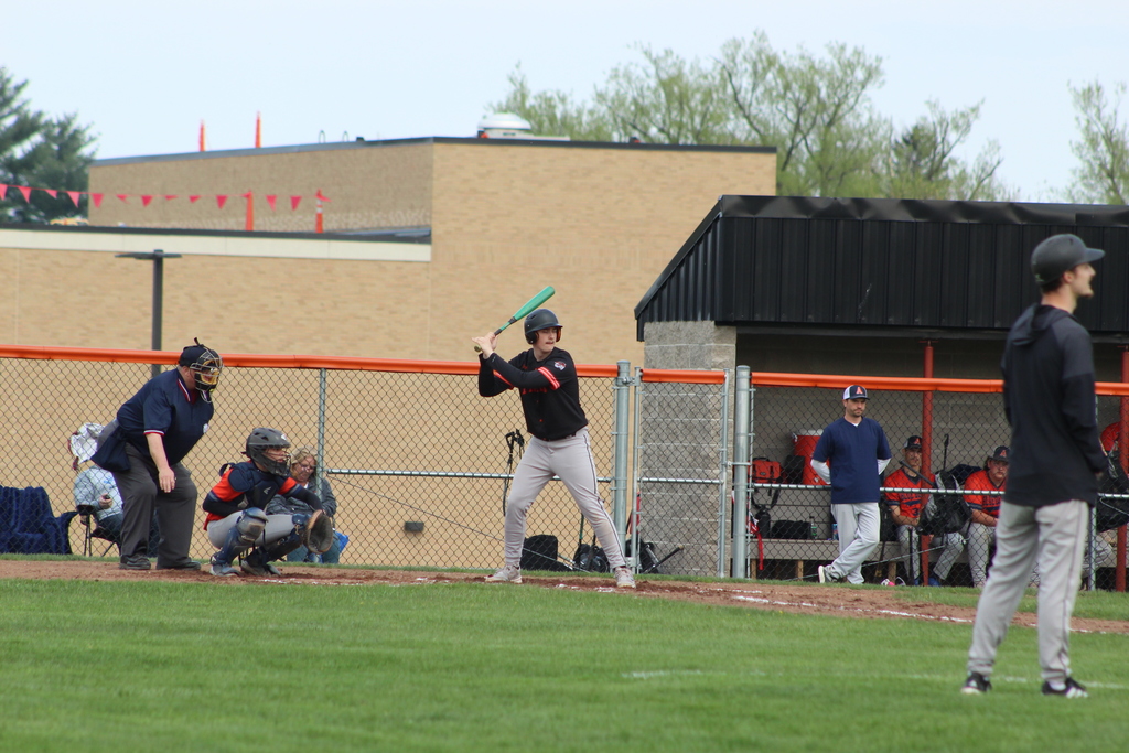 baseball player getting ready to hit ball