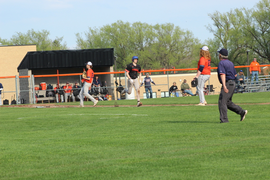 baseball player running to first base
