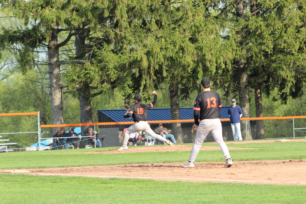 baseball player pitching ball