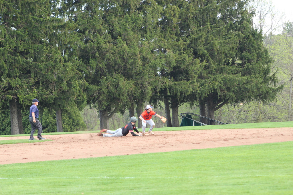 baseball player sliding into second base