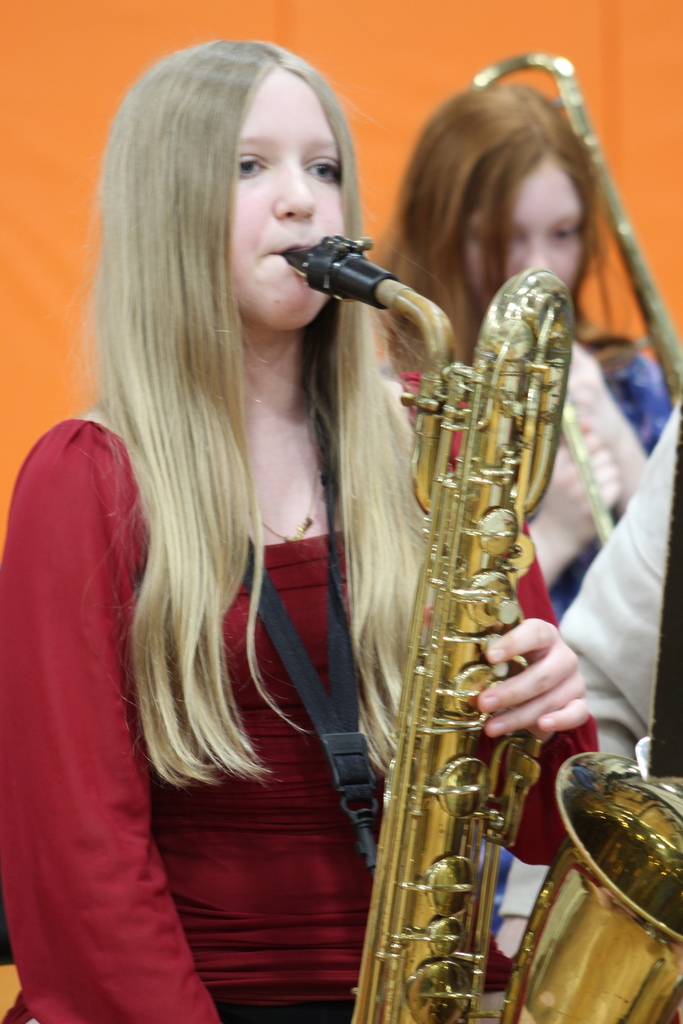 girl playing brass instrument