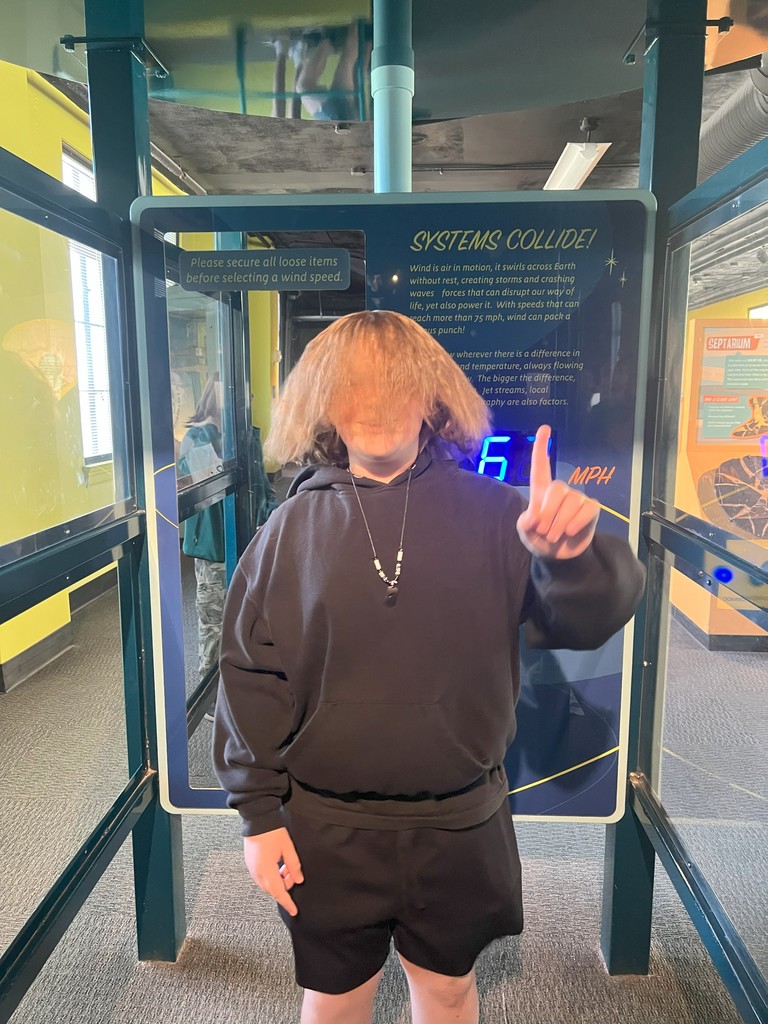 student standing in front of museum exhibit