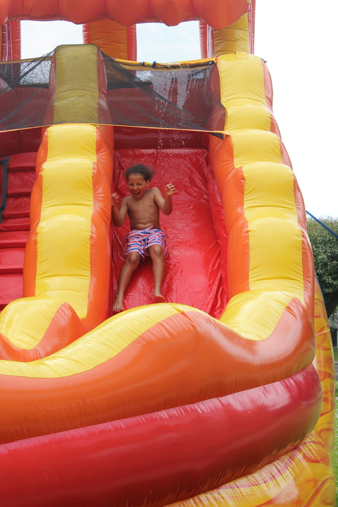 boy sliding down waterslide