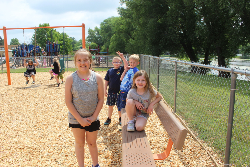 students posing for a photo on the playground