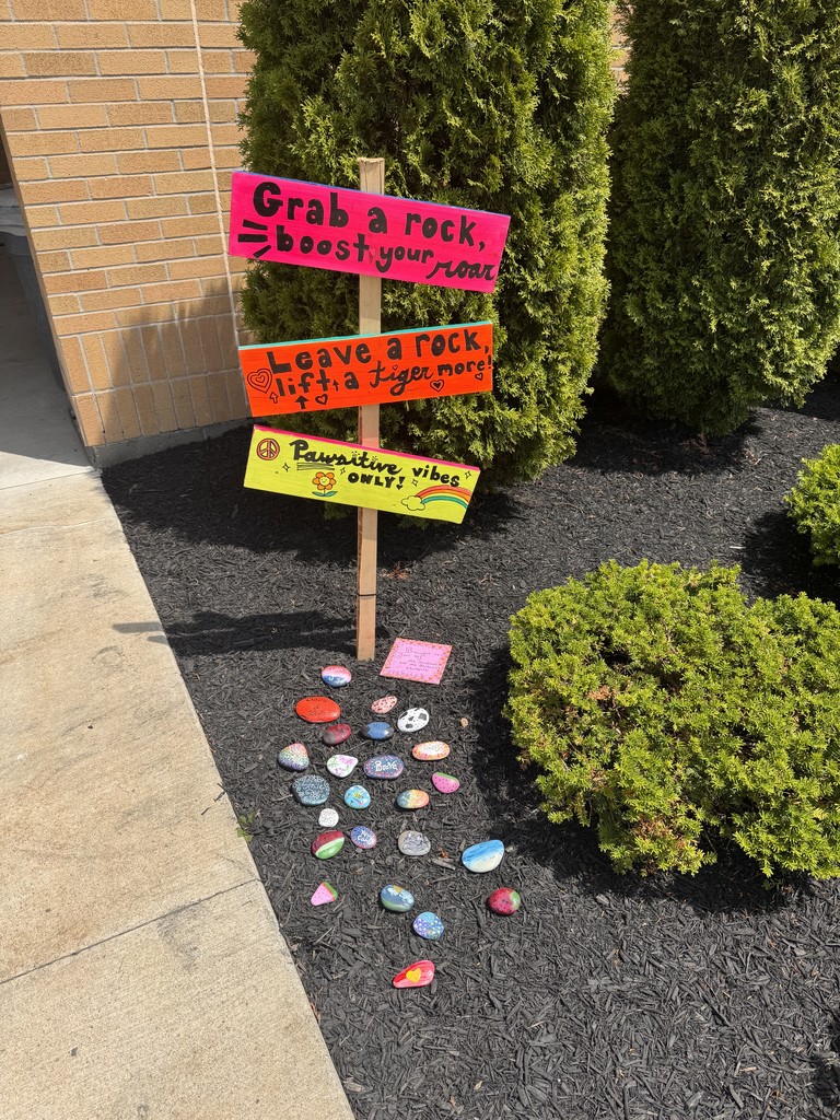 sign and rocks in landscaping
