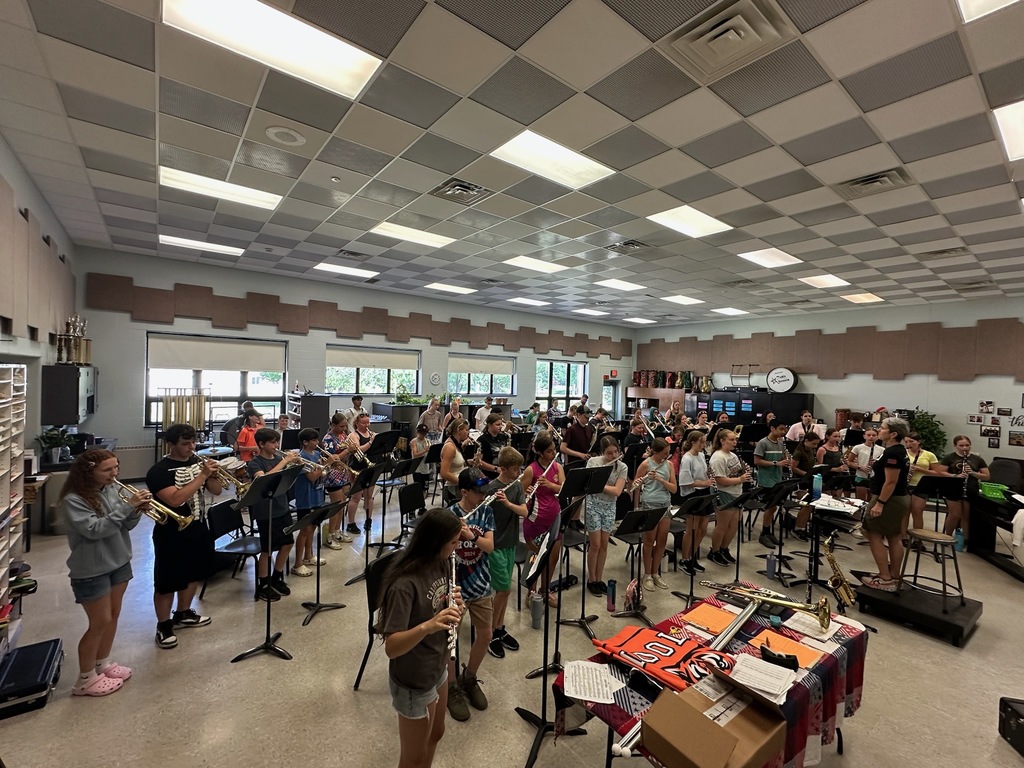 students playing instruments in music room