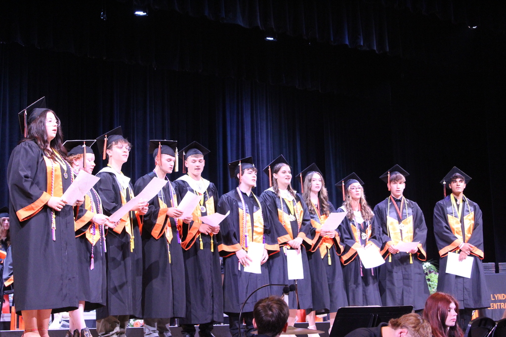 students singing on stage