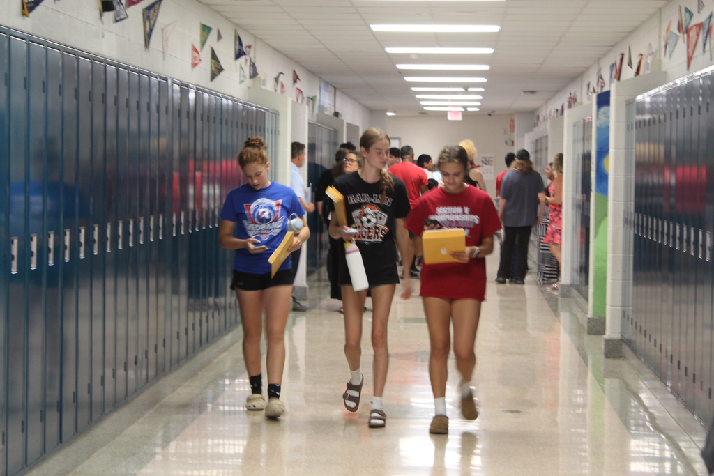 students walking down hallway