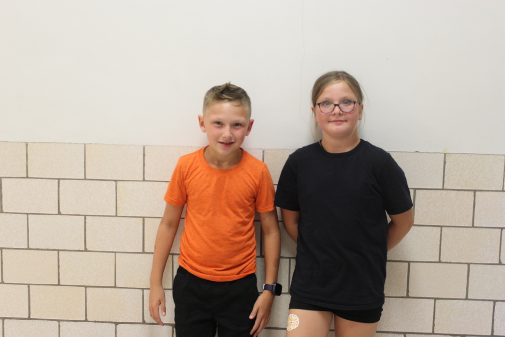 boy and girl standing in hallway