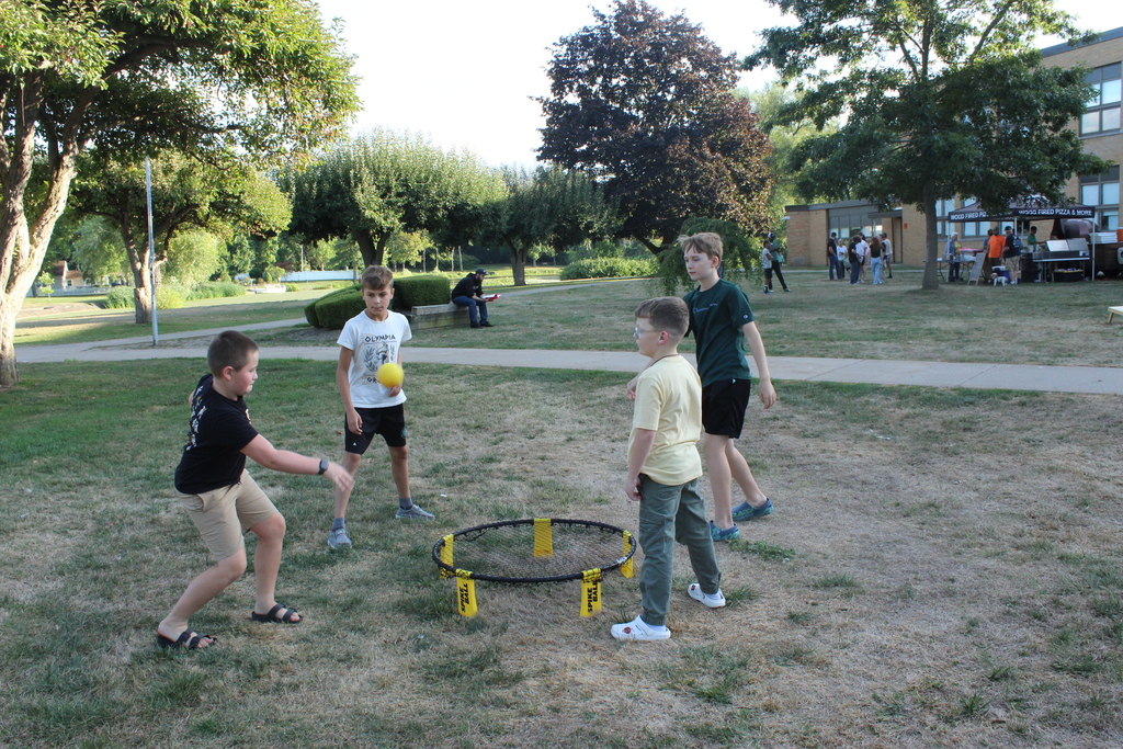 four boys playing lawn game