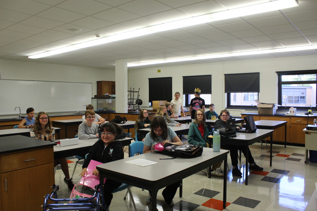 students sitting at desks in classroom