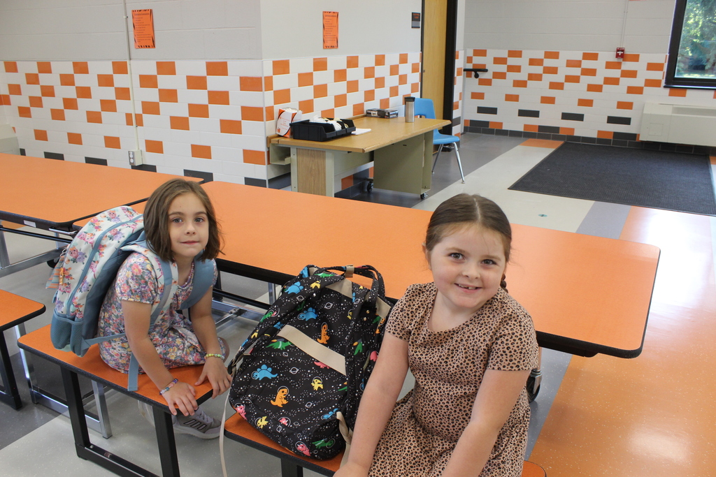 two girls sitting in cafeteria