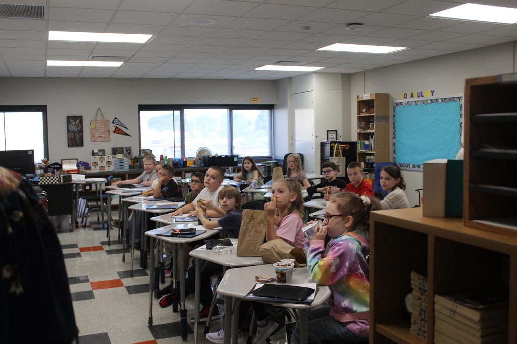 students sitting at desks in classroom