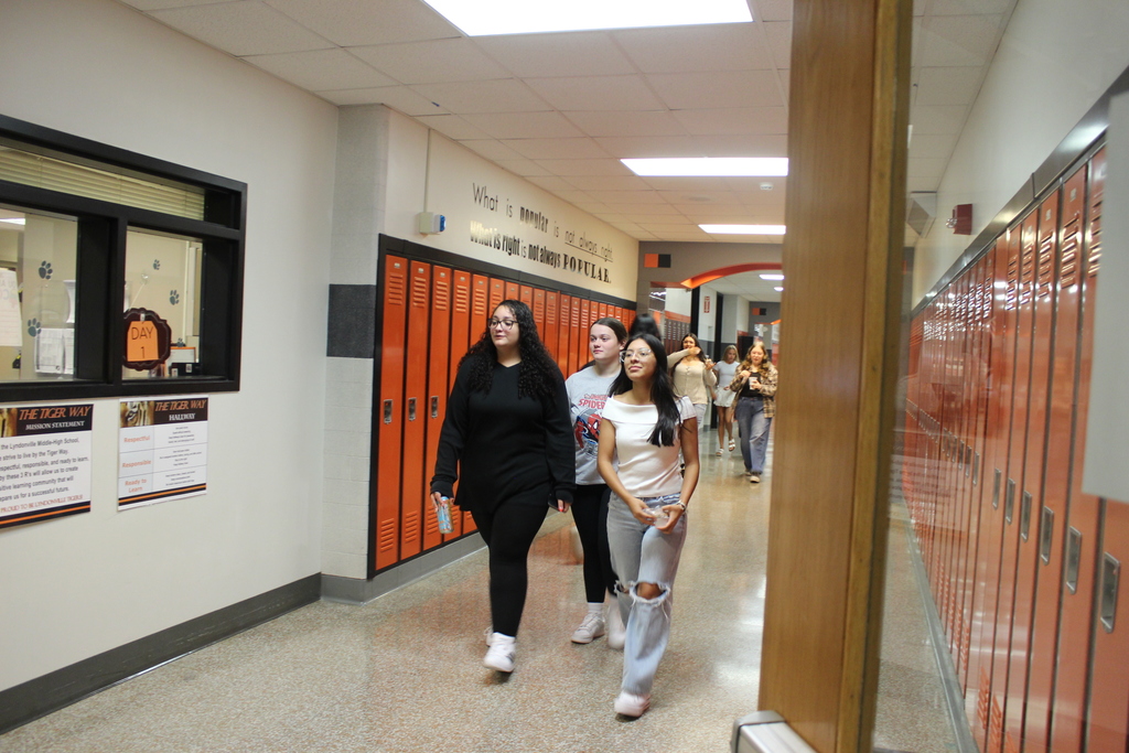 students walking down hallway