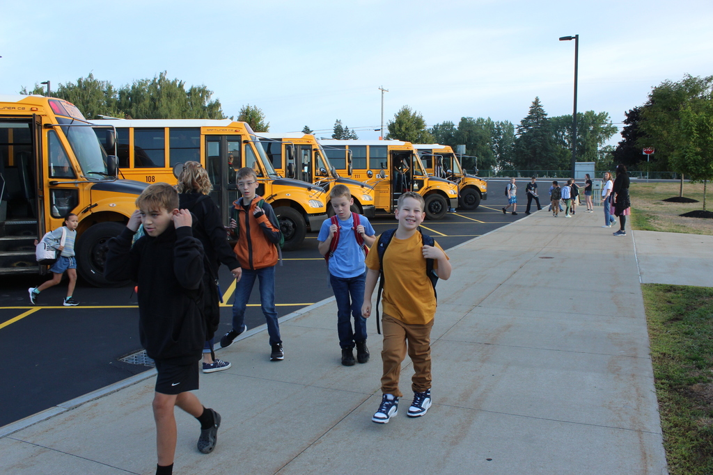 students walking down sidewalk
