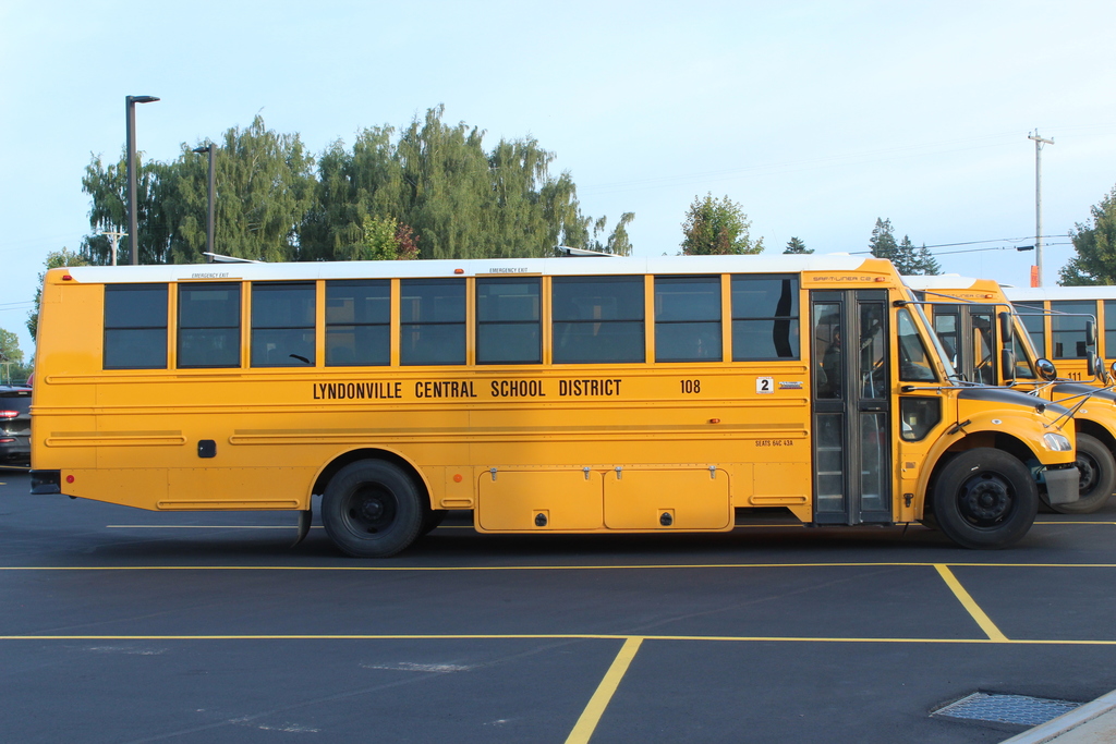 school bus parked in front of school