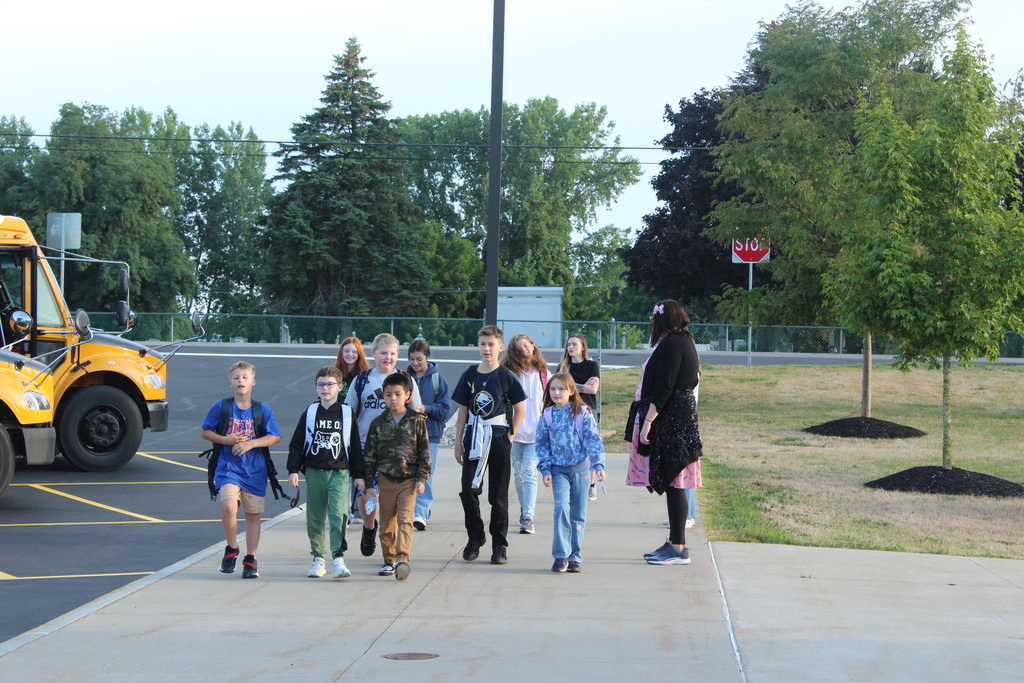 students walking down sidewalk