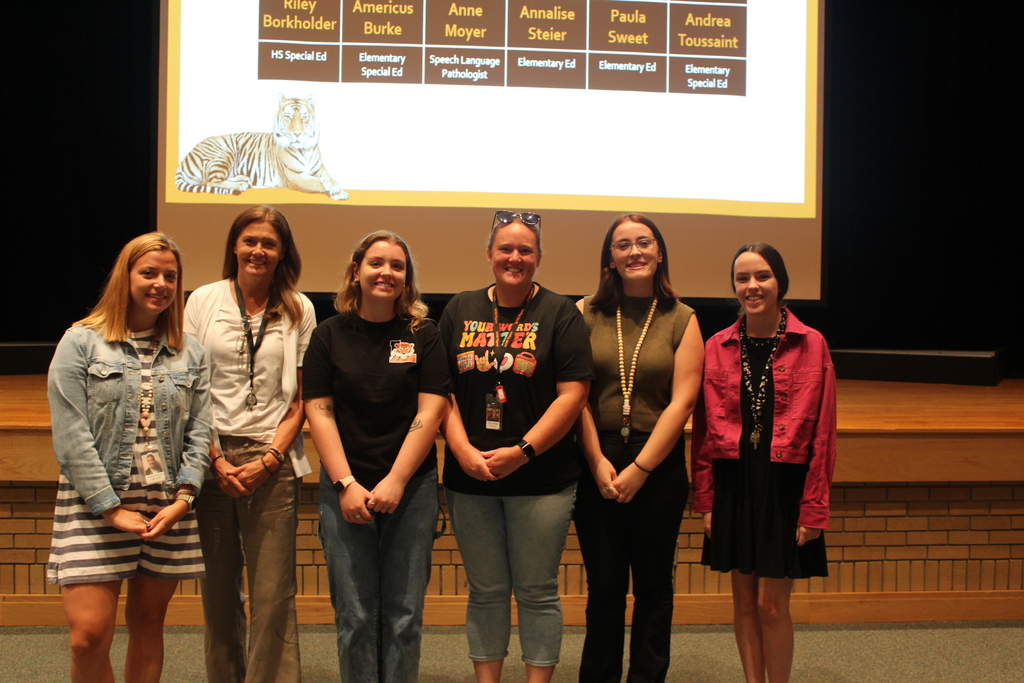 six teachers standing together