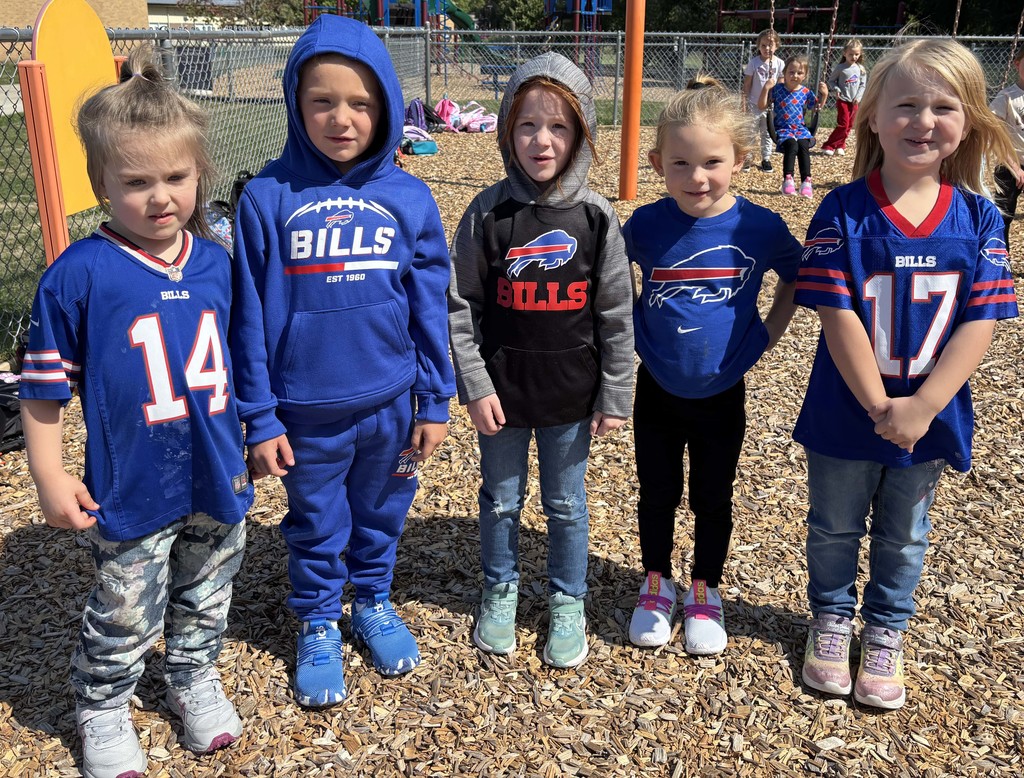 five students wearing Buffalo Bills attire