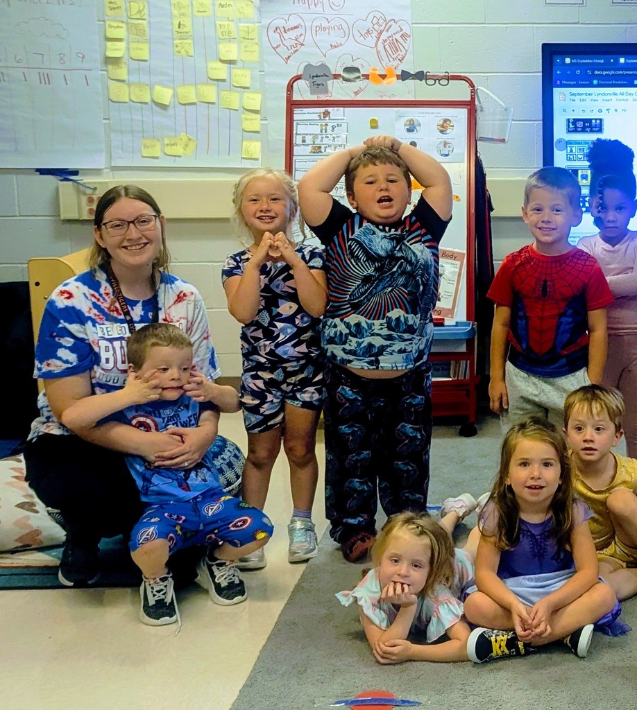 students and teacher wearing pjs in classroom