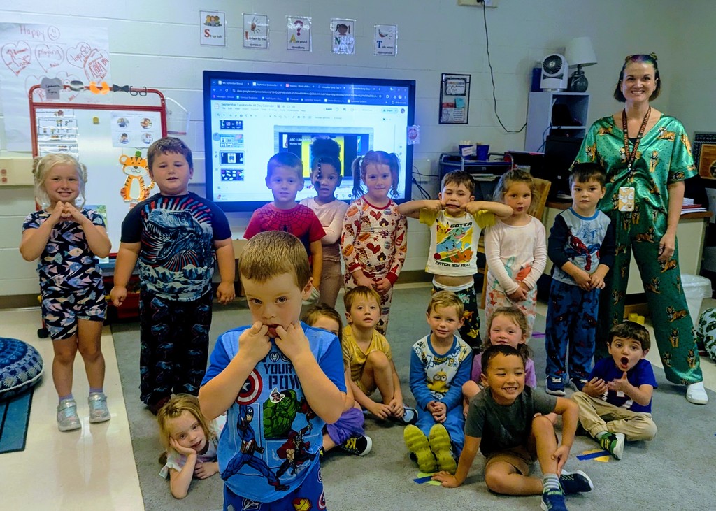 students and teacher wearing pjs in classroom