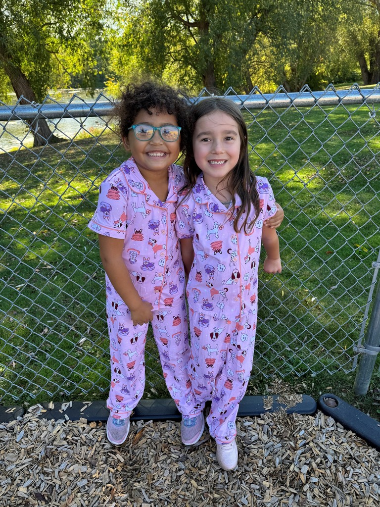 two girls wearing matching pjs