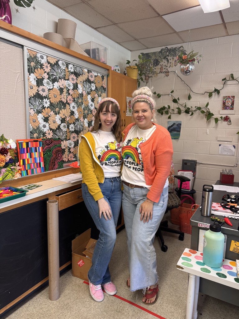 two teachers wearing matching outfits