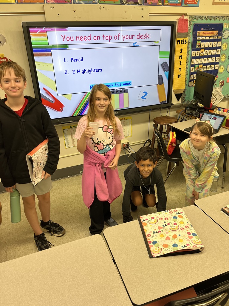 four students wearing outfits