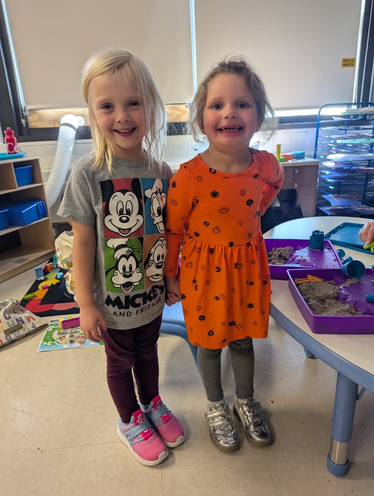 two girls wearing outfits