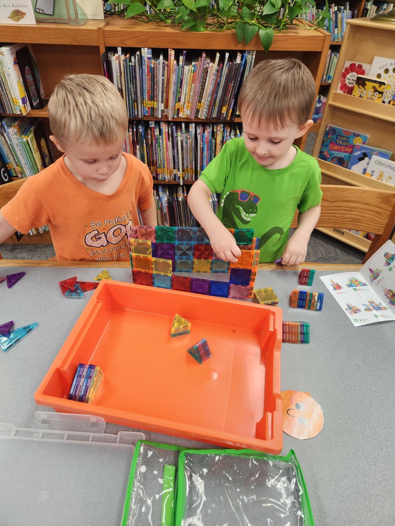 two boys playing at a table