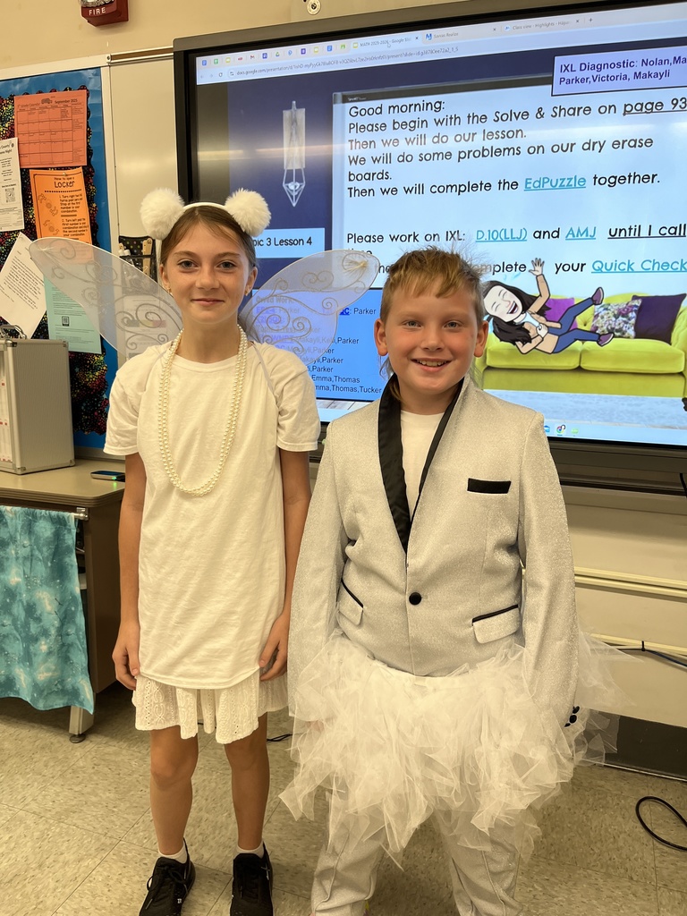 two students wearing white outfits