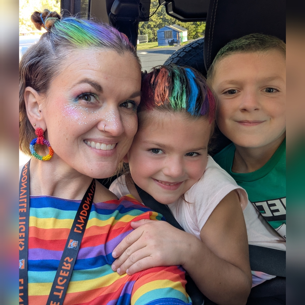 teacher and two students wearing outfits
