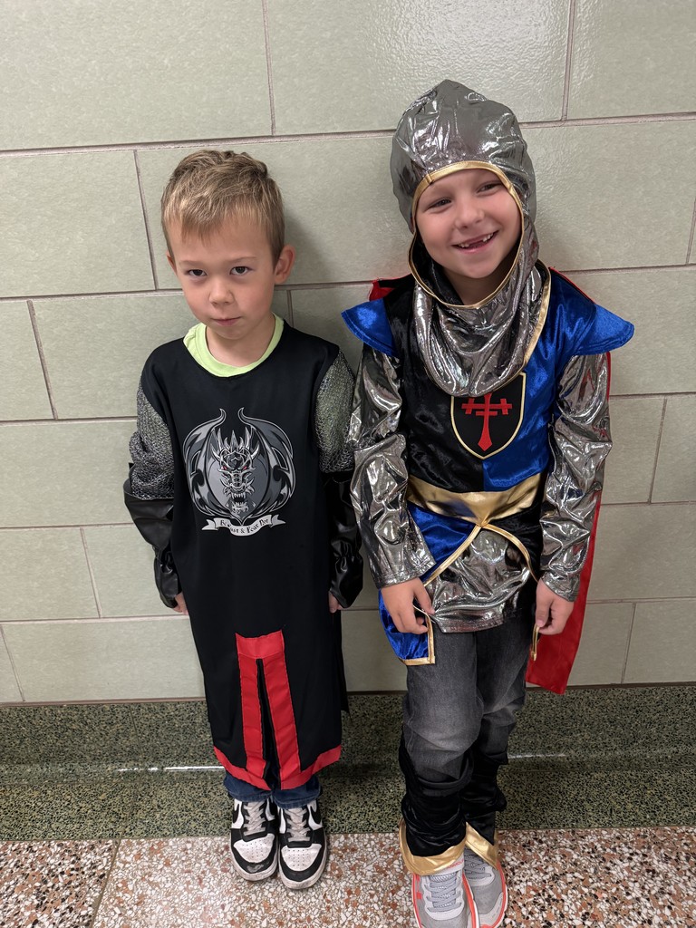 two boys wearing outfits