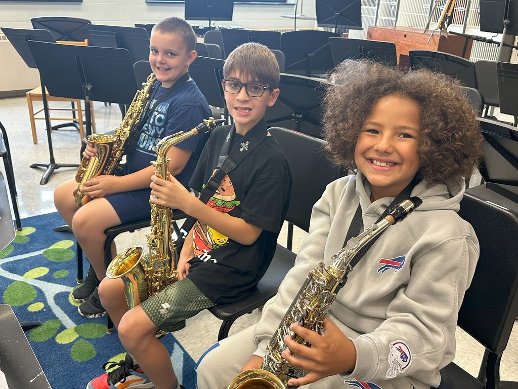 three students with their saxophones