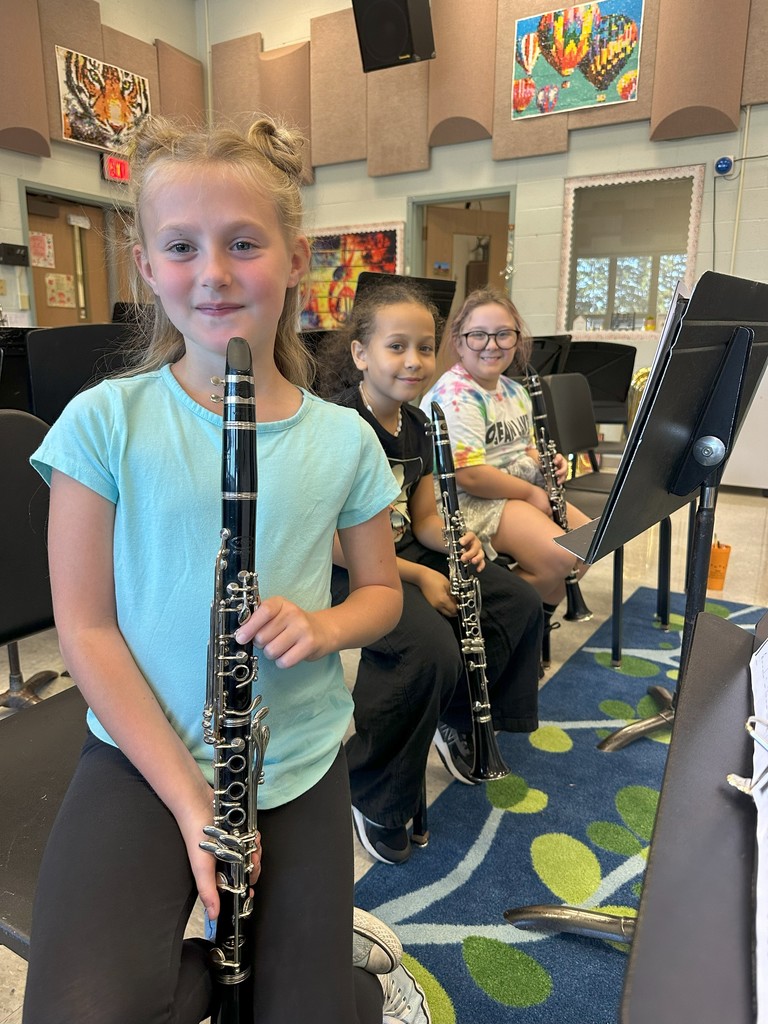 three students with their clarinets
