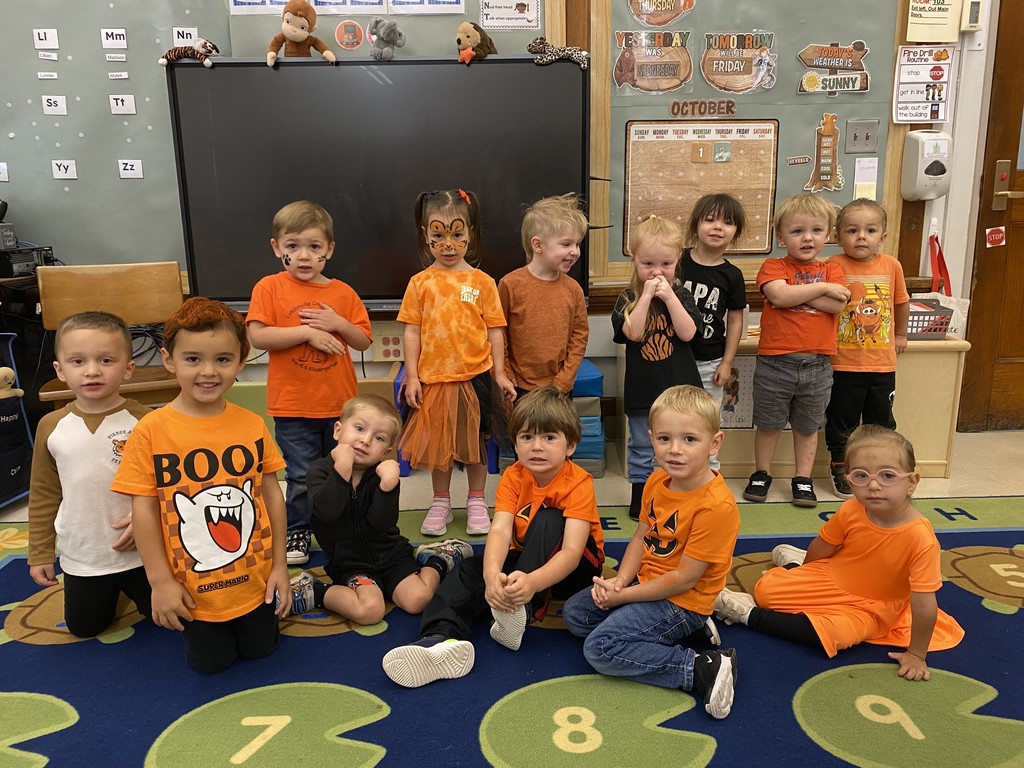 group of students wearing orange and black