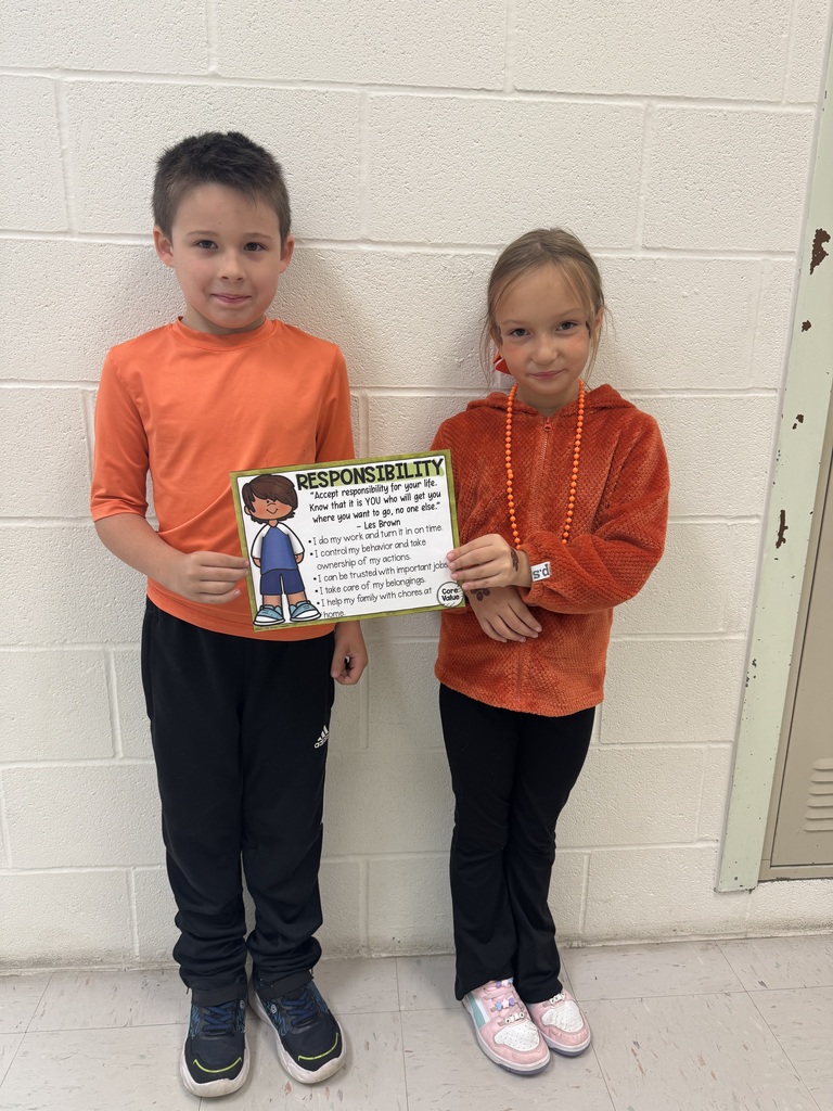 two students holding a certificate between them