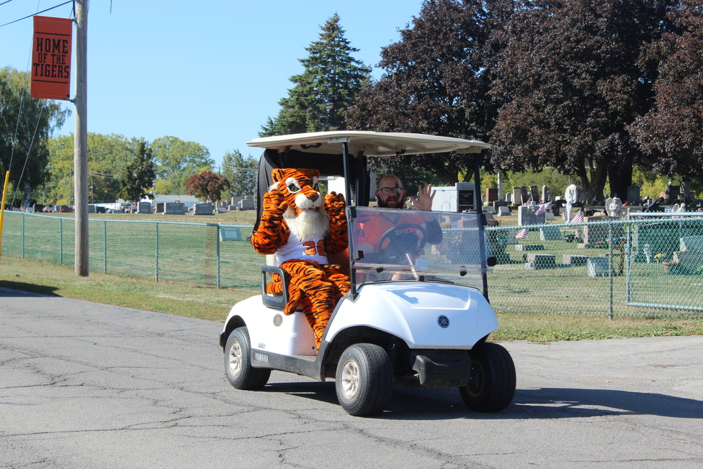 two people riding in golf cart