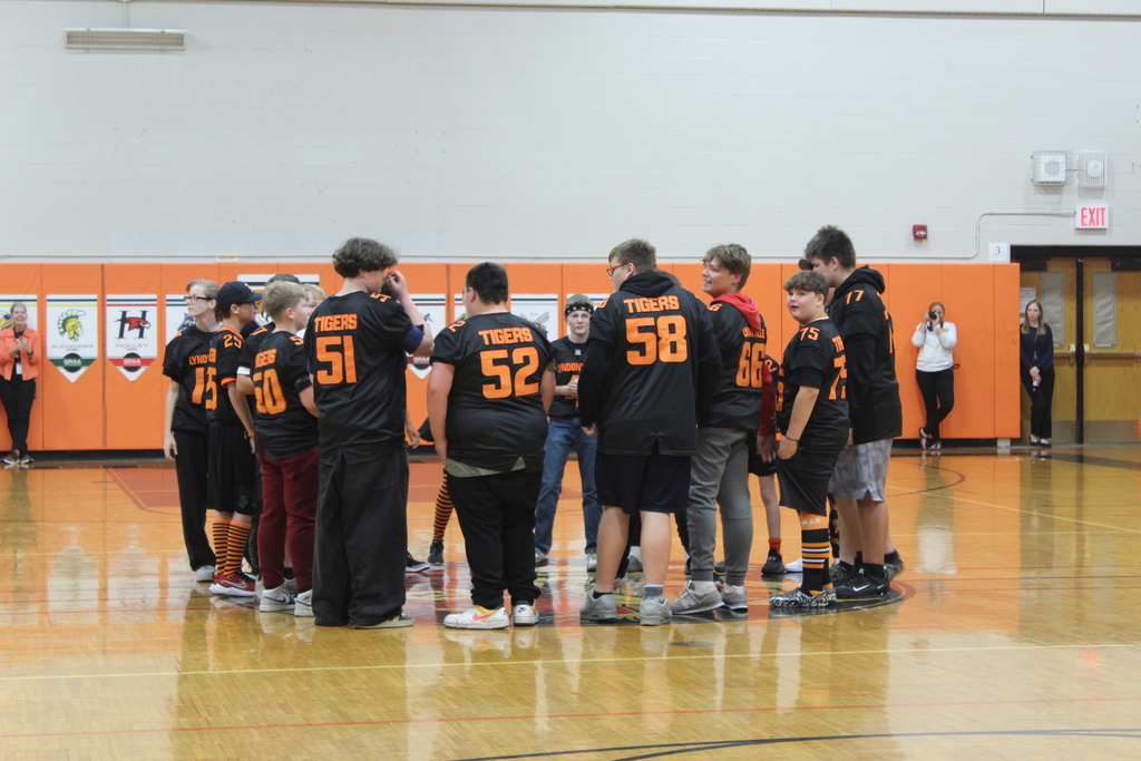 team gathered in gym
