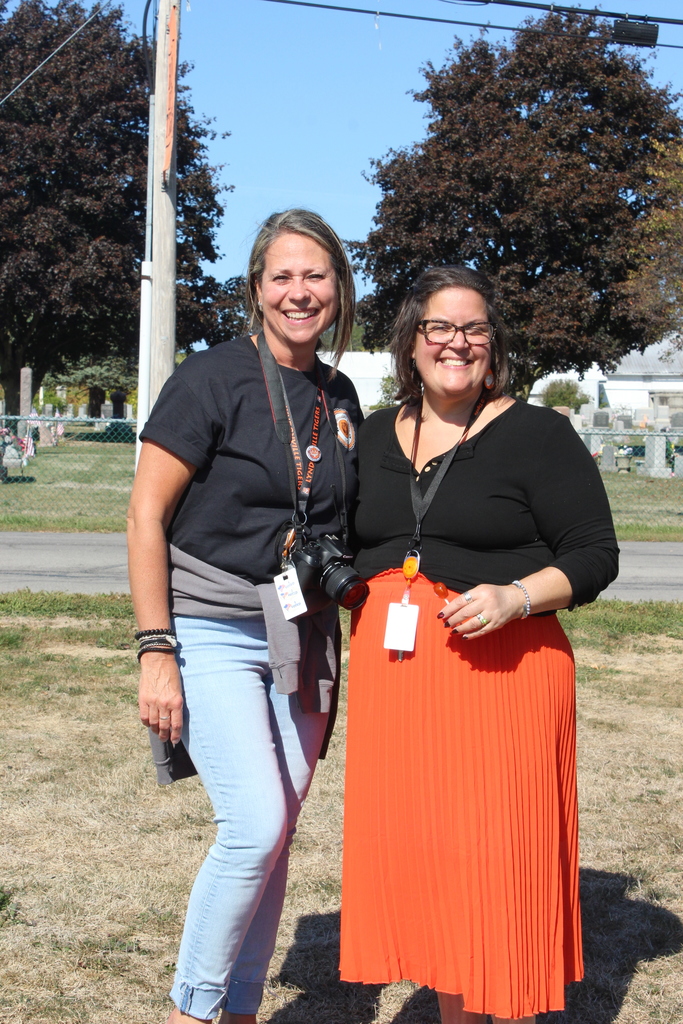two teachers standing outside