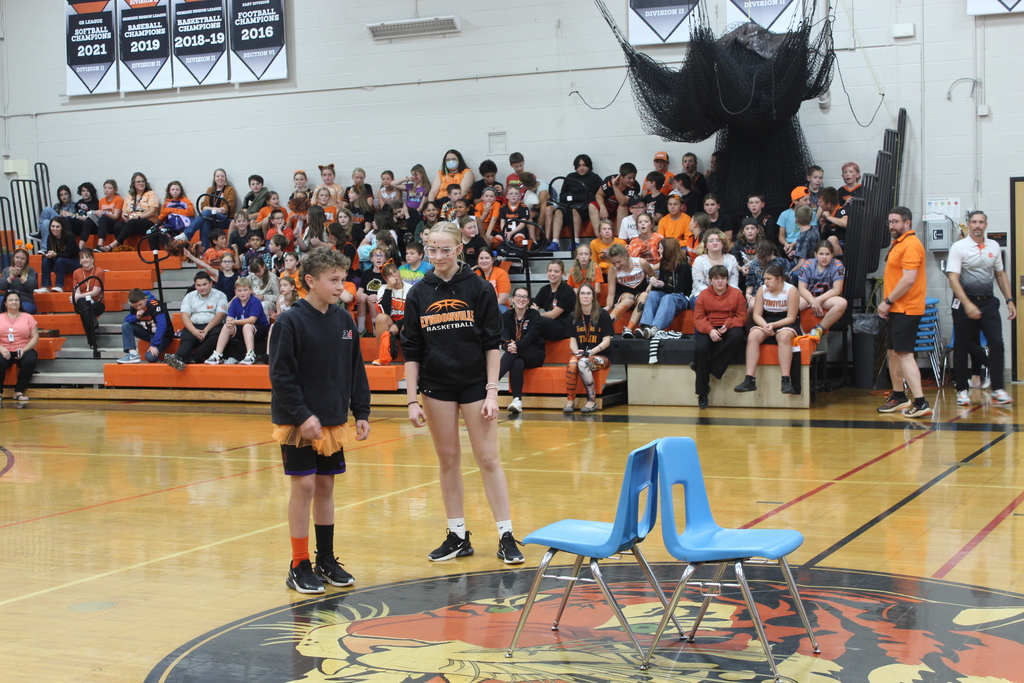 two students playing musical chairs