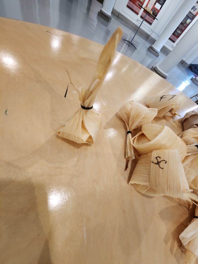 corn dolls on table